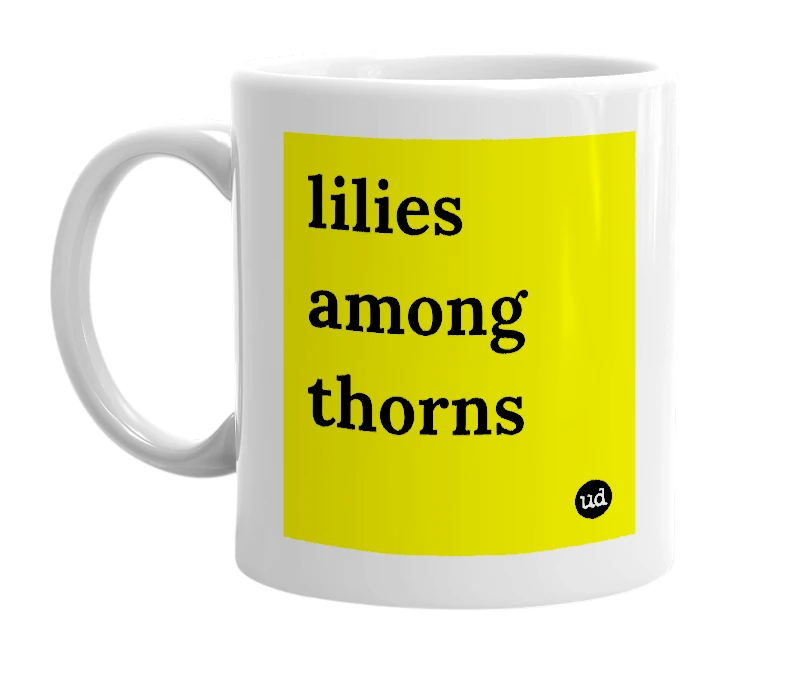 White mug with 'lilies among thorns' in bold black letters