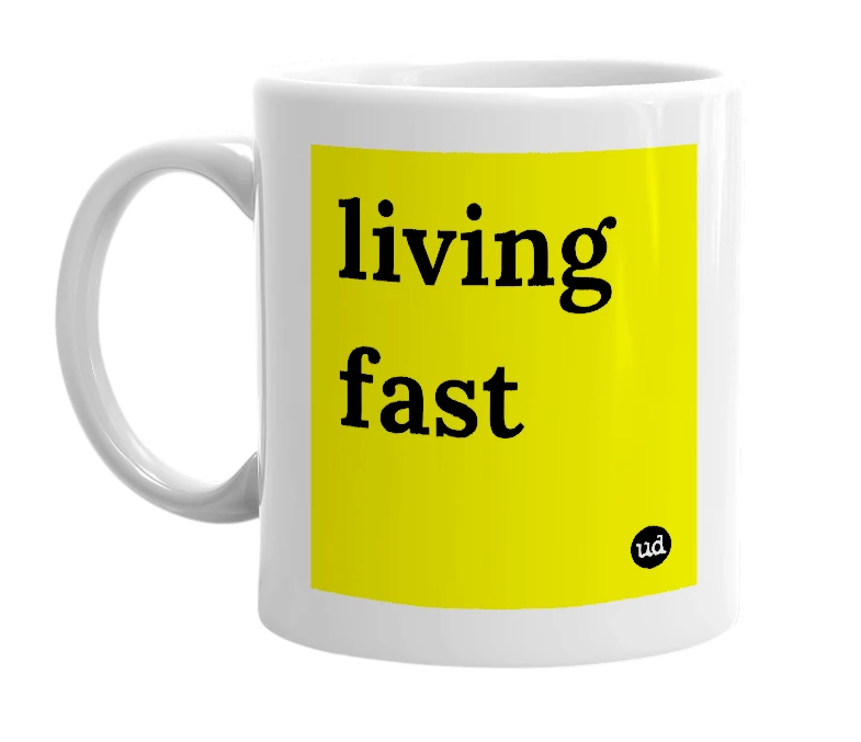 White mug with 'living fast' in bold black letters