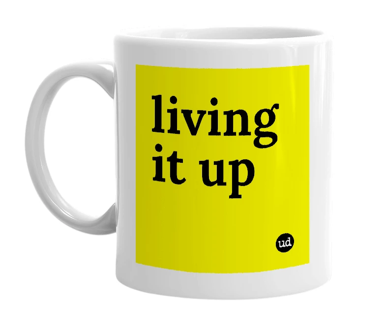 White mug with 'living it up' in bold black letters