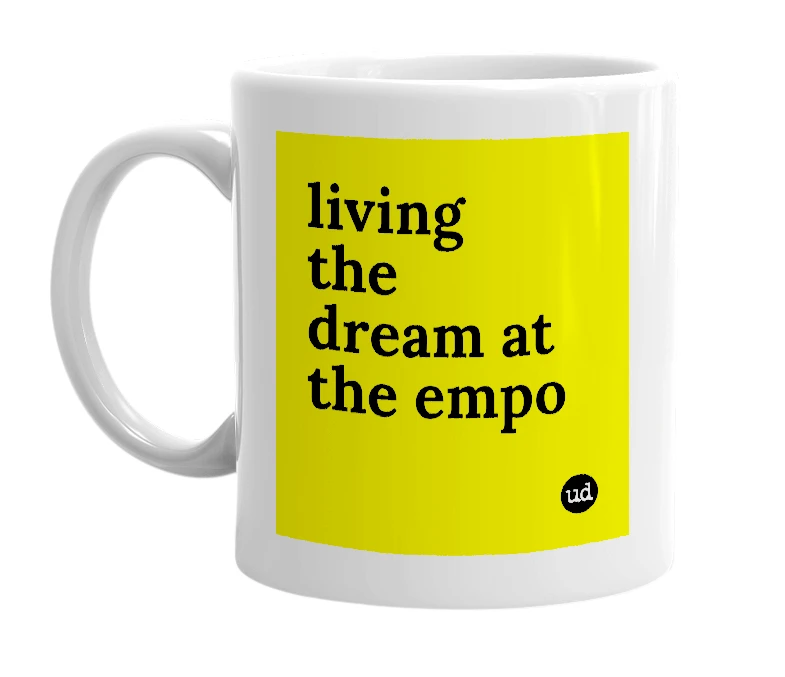 White mug with 'living the dream at the empo' in bold black letters