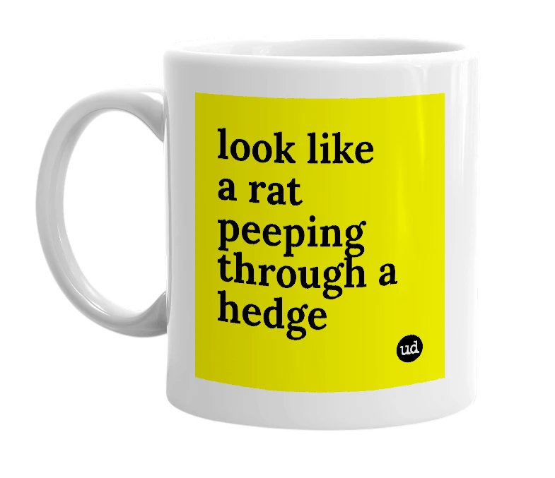 White mug with 'look like a rat peeping through a hedge' in bold black letters