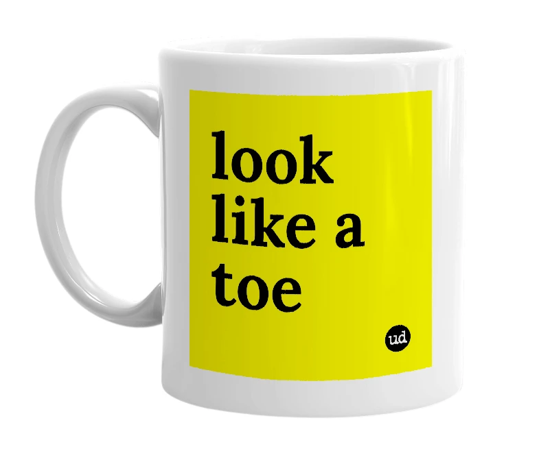 White mug with 'look like a toe' in bold black letters