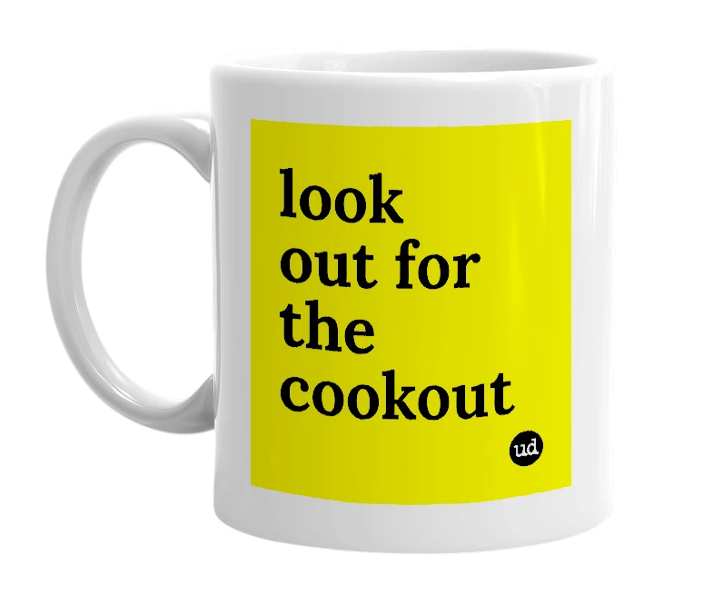 White mug with 'look out for the cookout' in bold black letters