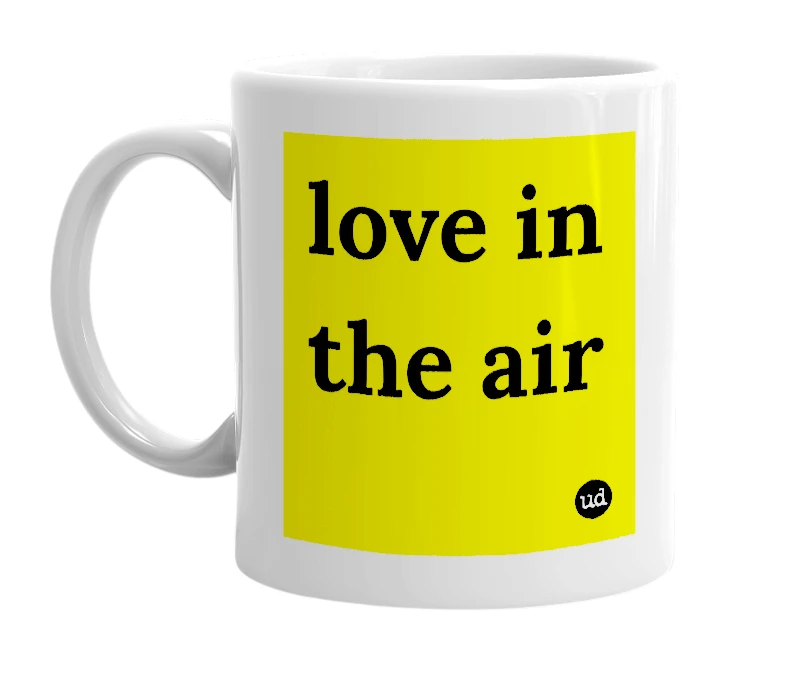 White mug with 'love in the air' in bold black letters