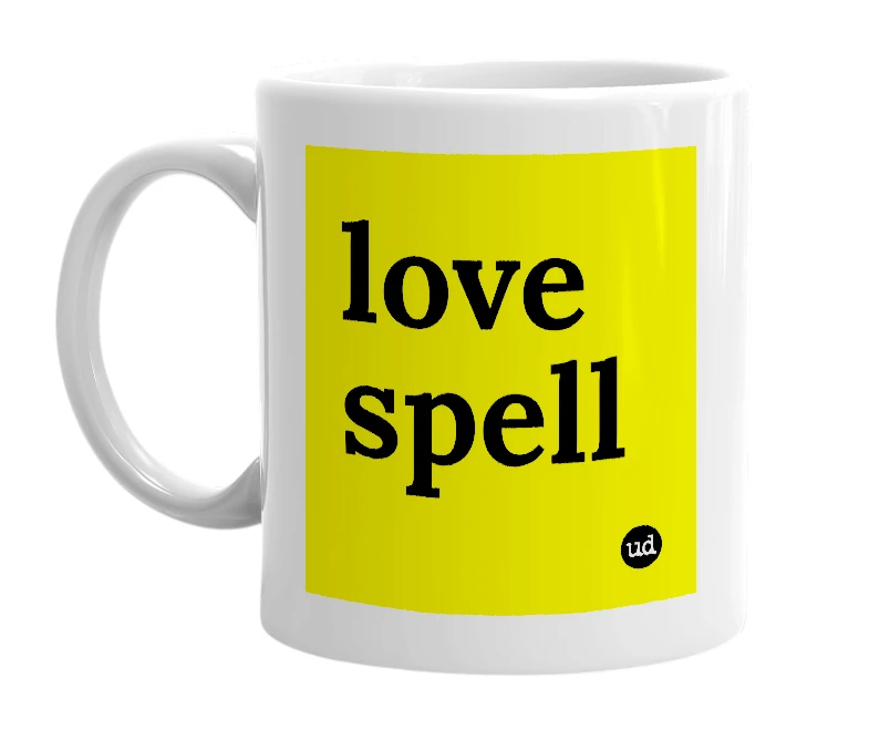 White mug with 'love spell' in bold black letters