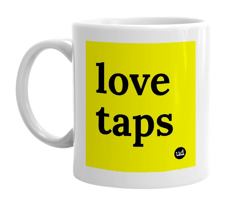 White mug with 'love taps' in bold black letters