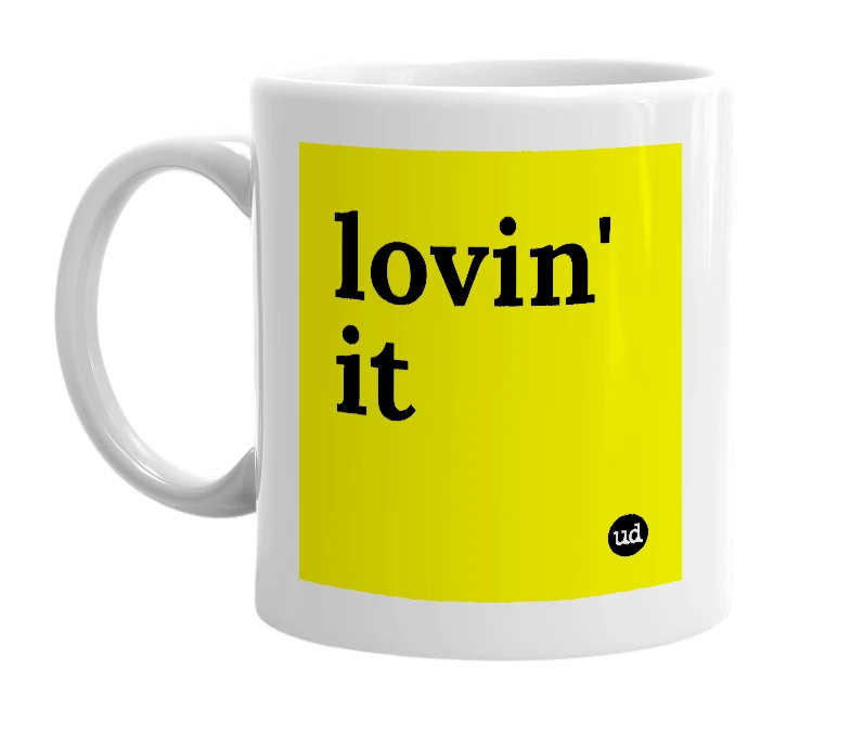 White mug with 'lovin' it' in bold black letters