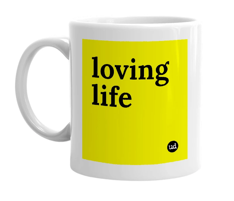 White mug with 'loving life' in bold black letters