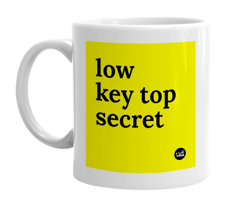 White mug with 'low key top secret' in bold black letters