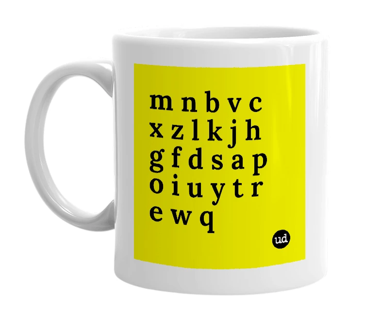 White mug with 'm n b v c x z l k j h g f d s a p o i u y t r e w q' in bold black letters