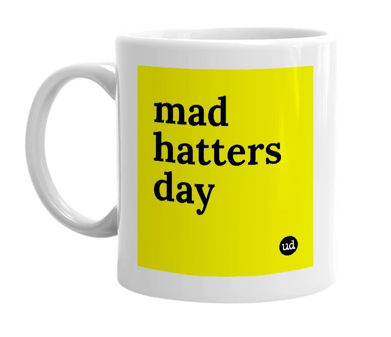 White mug with 'mad hatters day' in bold black letters