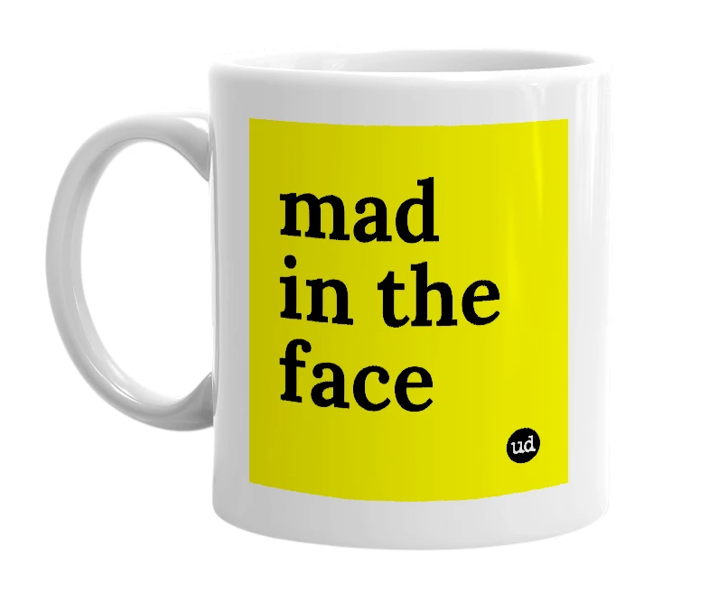 White mug with 'mad in the face' in bold black letters