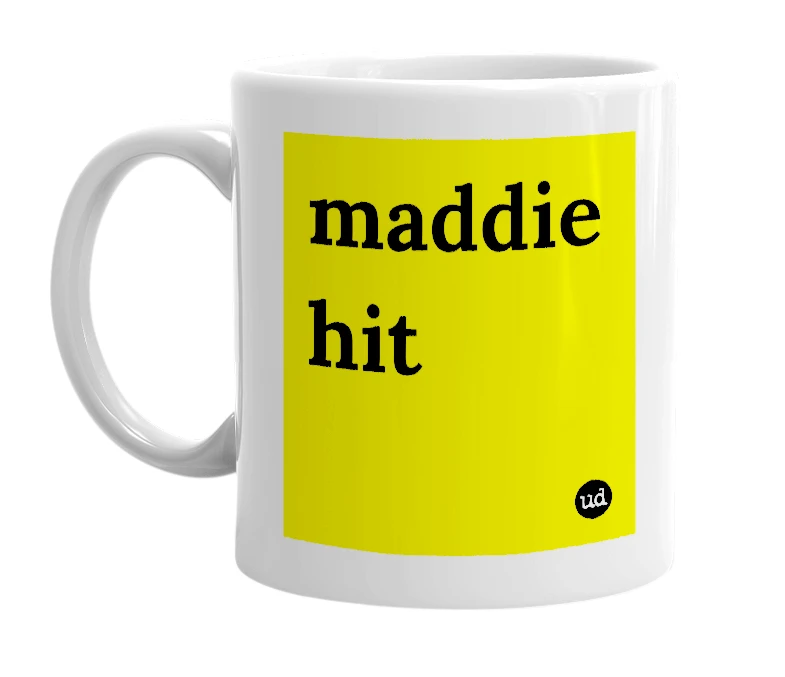 White mug with 'maddie hit' in bold black letters