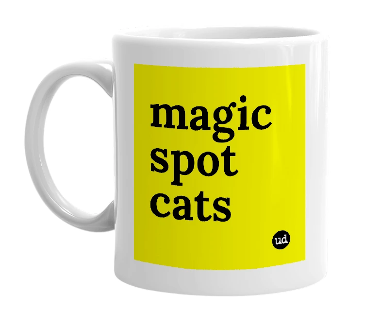 White mug with 'magic spot cats' in bold black letters
