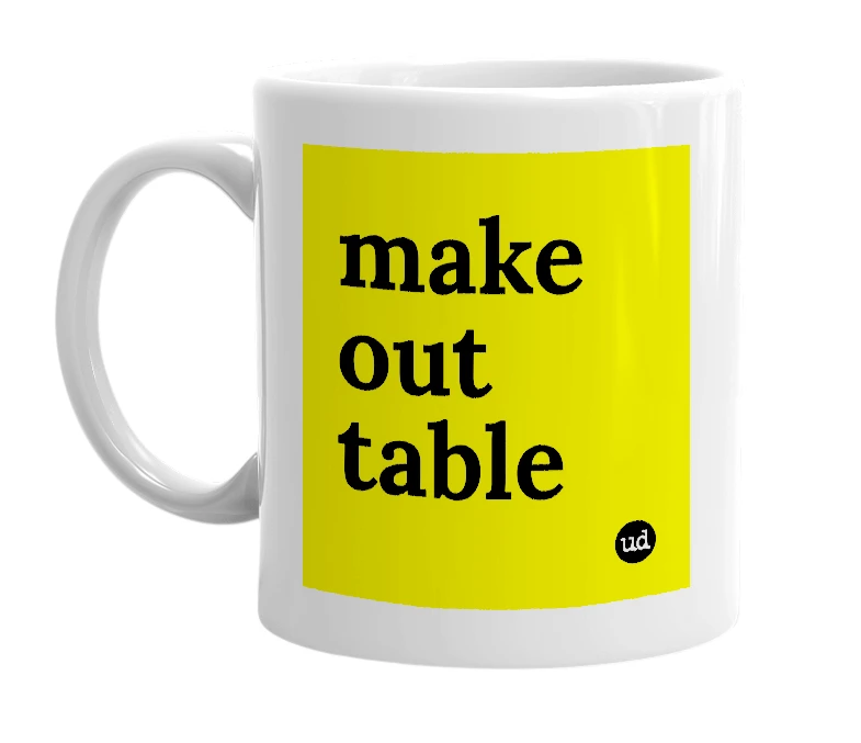 White mug with 'make out table' in bold black letters
