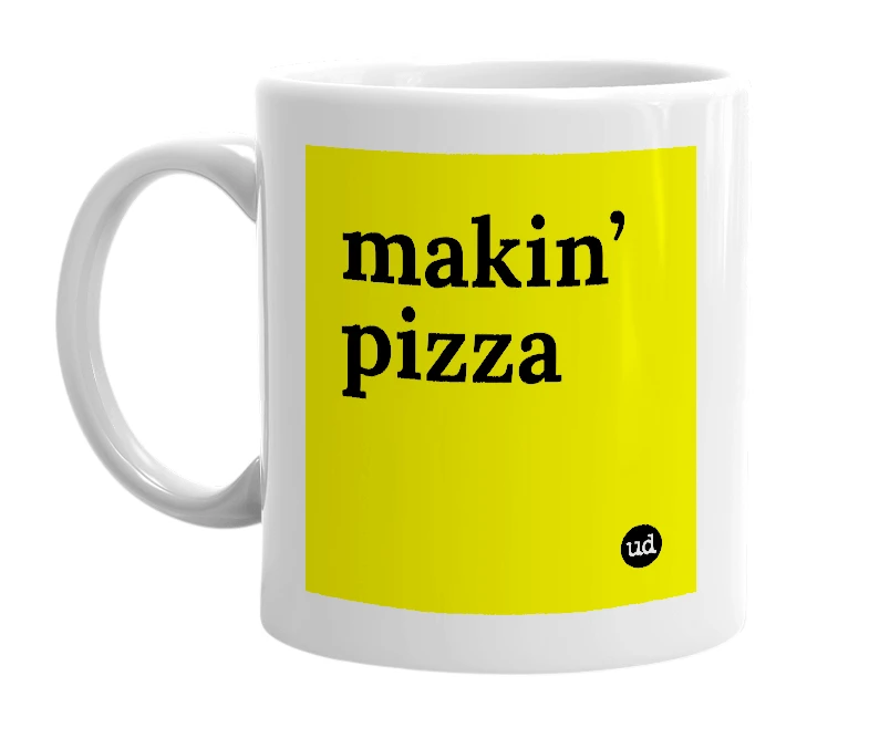 White mug with 'makin’ pizza' in bold black letters