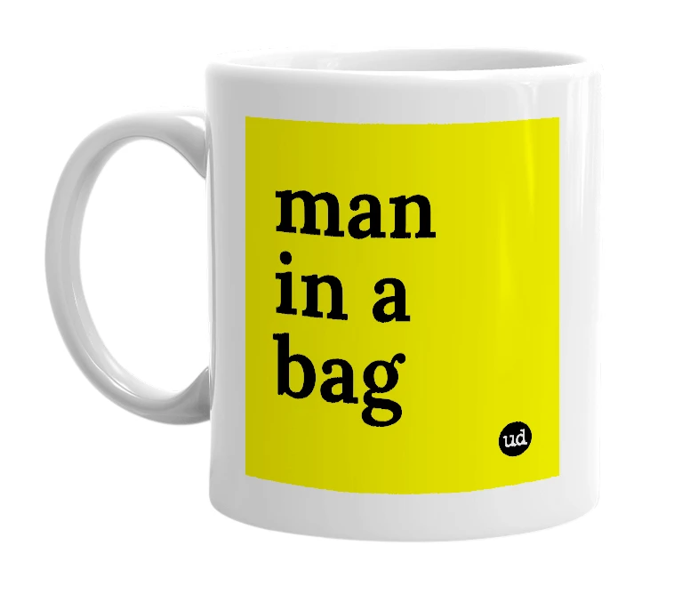 White mug with 'man in a bag' in bold black letters