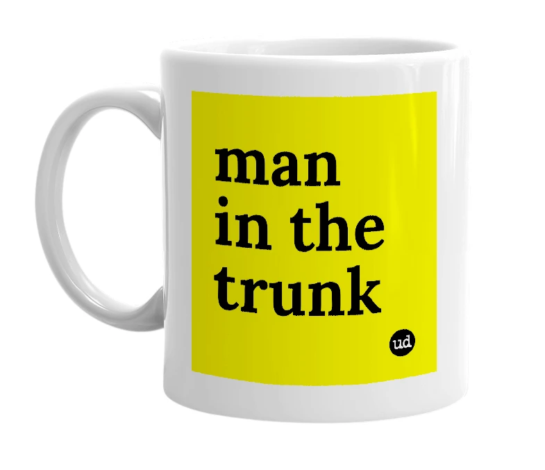 White mug with 'man in the trunk' in bold black letters