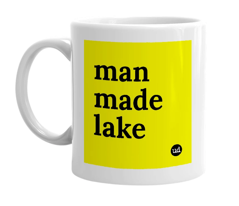 White mug with 'man made lake' in bold black letters