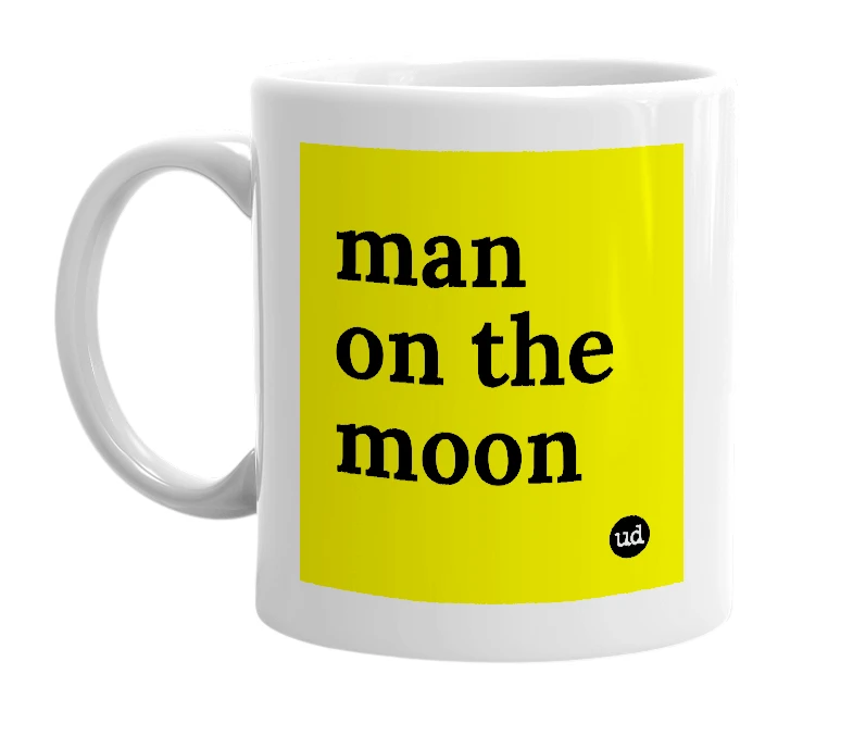 White mug with 'man on the moon' in bold black letters