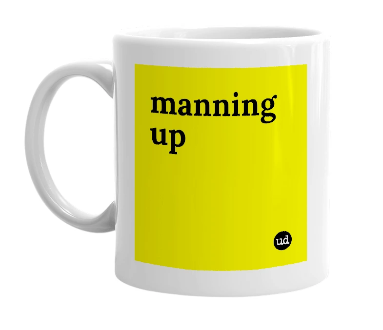 White mug with 'manning up' in bold black letters