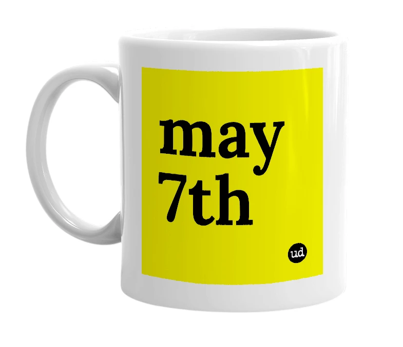 White mug with 'may 7th' in bold black letters