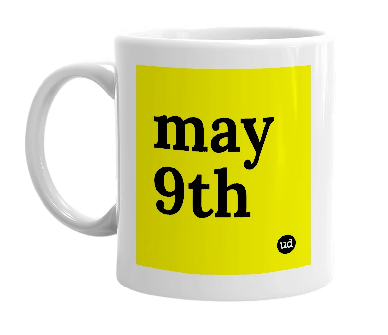 White mug with 'may 9th' in bold black letters