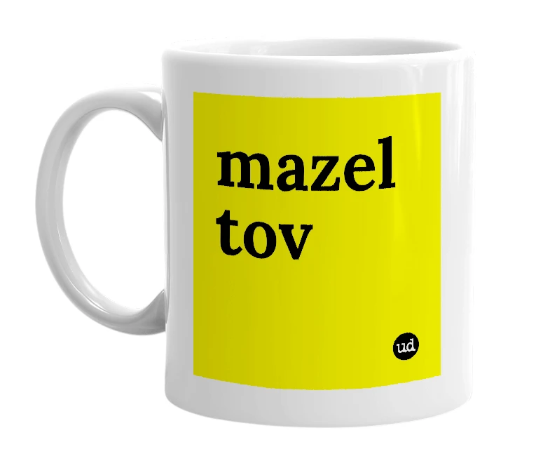 White mug with 'mazel tov' in bold black letters