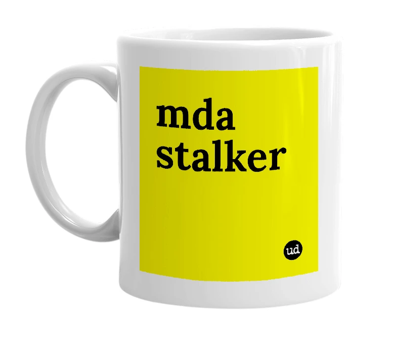 White mug with 'mda stalker' in bold black letters