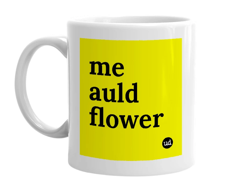 White mug with 'me auld flower' in bold black letters