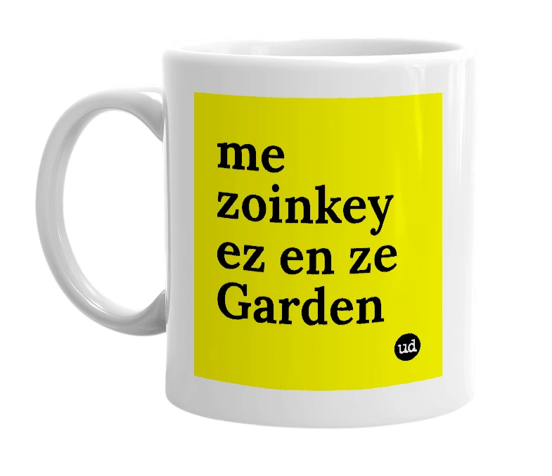 White mug with 'me zoinkey ez en ze Garden' in bold black letters