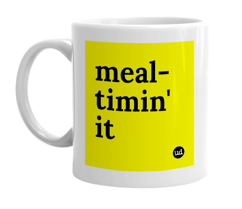 White mug with 'meal-timin' it' in bold black letters