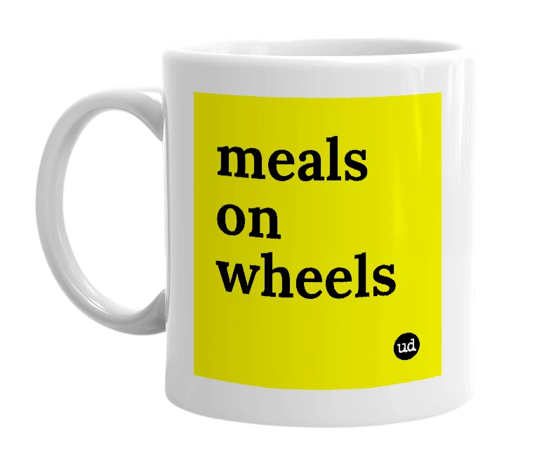 White mug with 'meals on wheels' in bold black letters