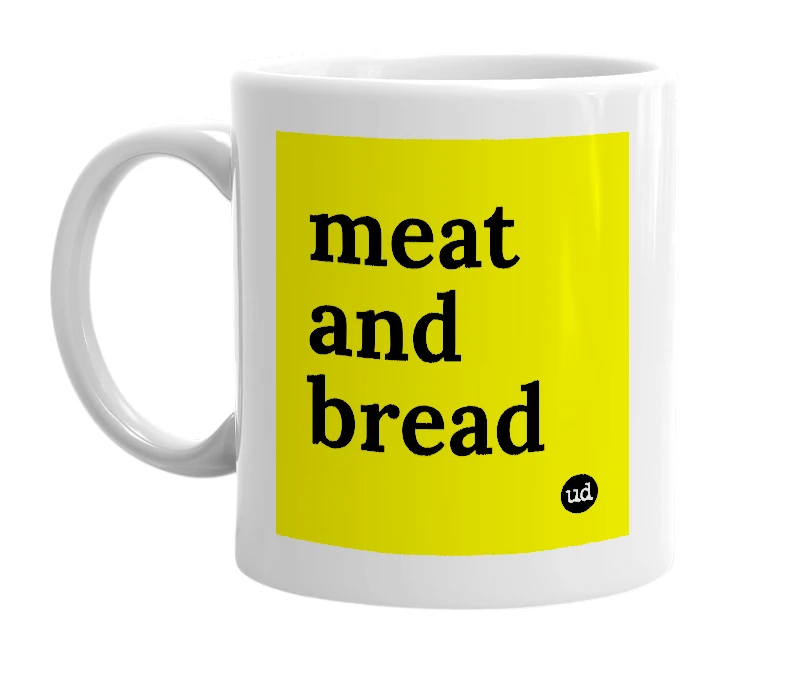 White mug with 'meat and bread' in bold black letters