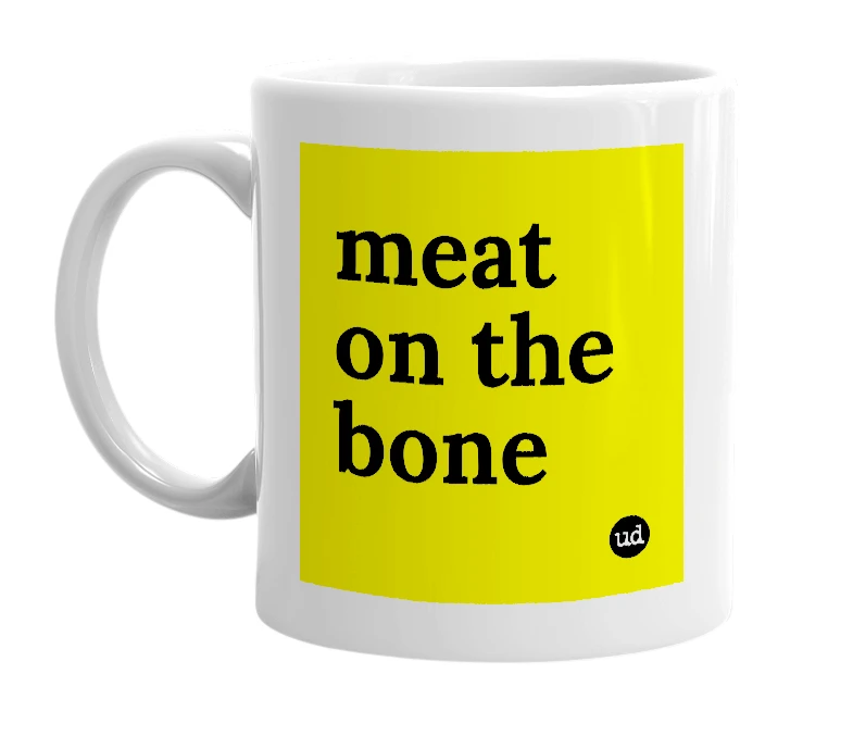 White mug with 'meat on the bone' in bold black letters