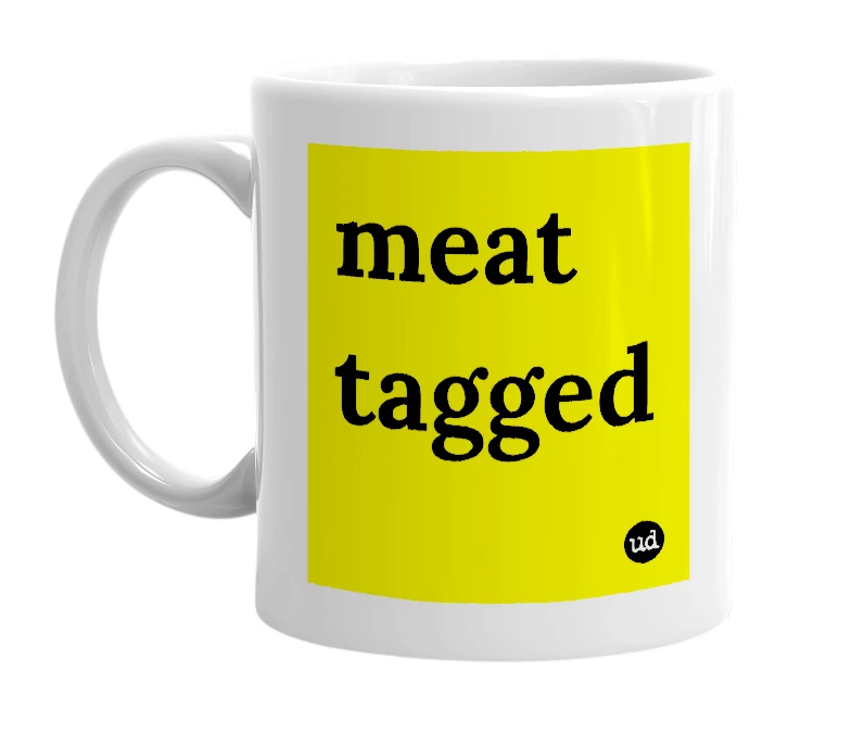 White mug with 'meat tagged' in bold black letters