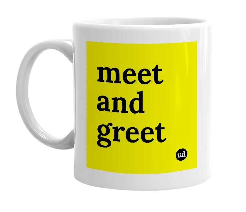 White mug with 'meet and greet' in bold black letters