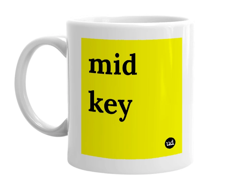 White mug with 'mid key' in bold black letters