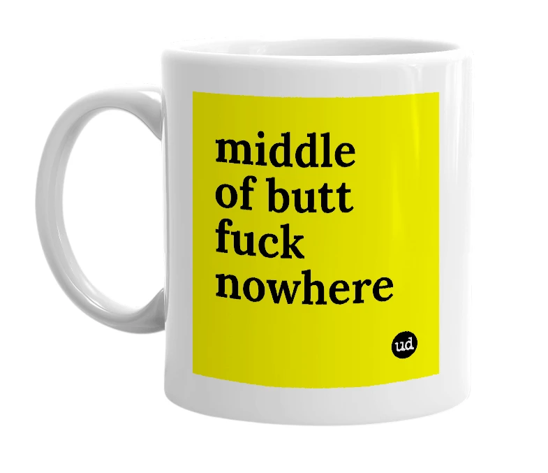 White mug with 'middle of butt fuck nowhere' in bold black letters
