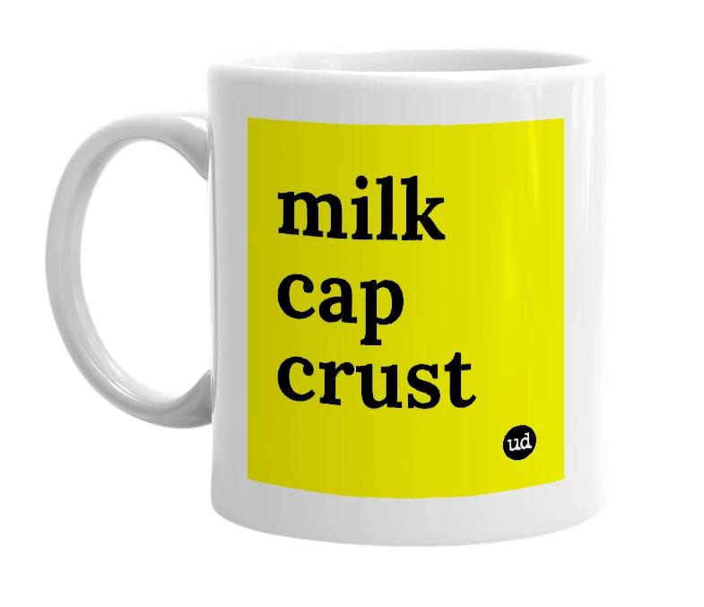 White mug with 'milk cap crust' in bold black letters