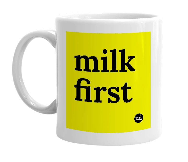 White mug with 'milk first' in bold black letters