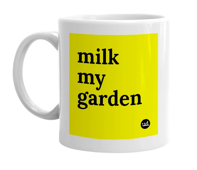 White mug with 'milk my garden' in bold black letters