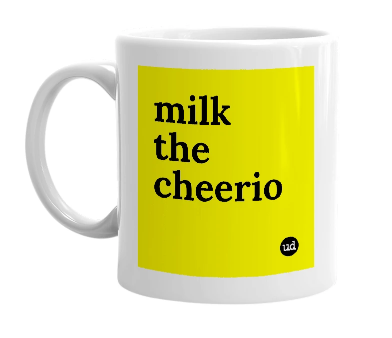 White mug with 'milk the cheerio' in bold black letters