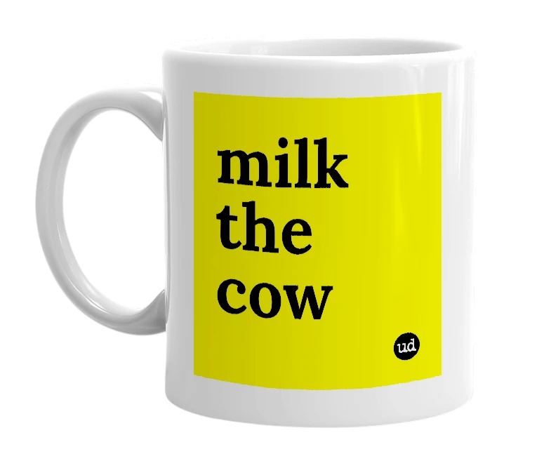 White mug with 'milk the cow' in bold black letters