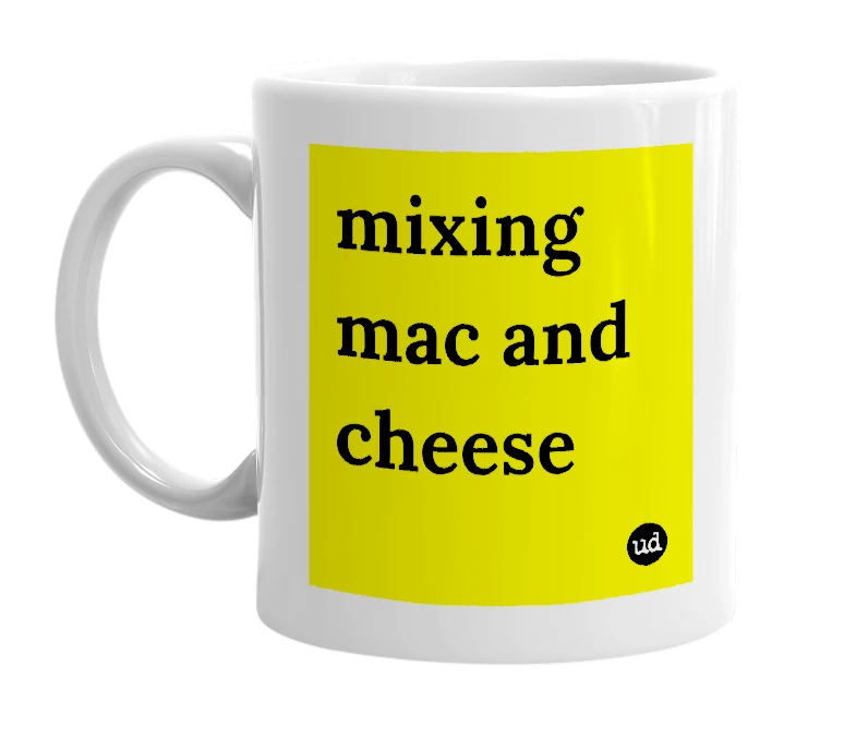 White mug with 'mixing mac and cheese' in bold black letters