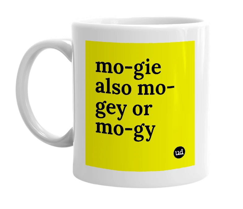 White mug with 'mo-gie also mo-gey or mo-gy' in bold black letters