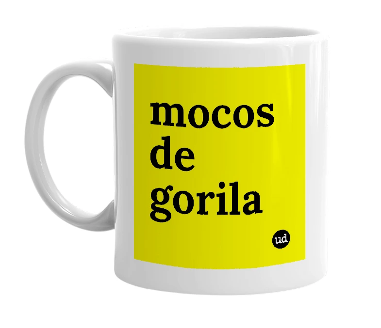 White mug with 'mocos de gorila' in bold black letters