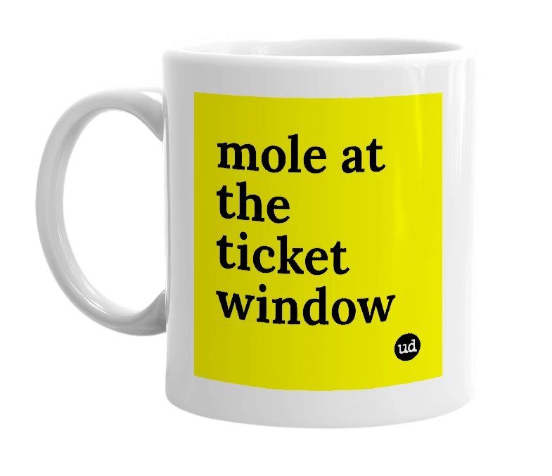 White mug with 'mole at the ticket window' in bold black letters