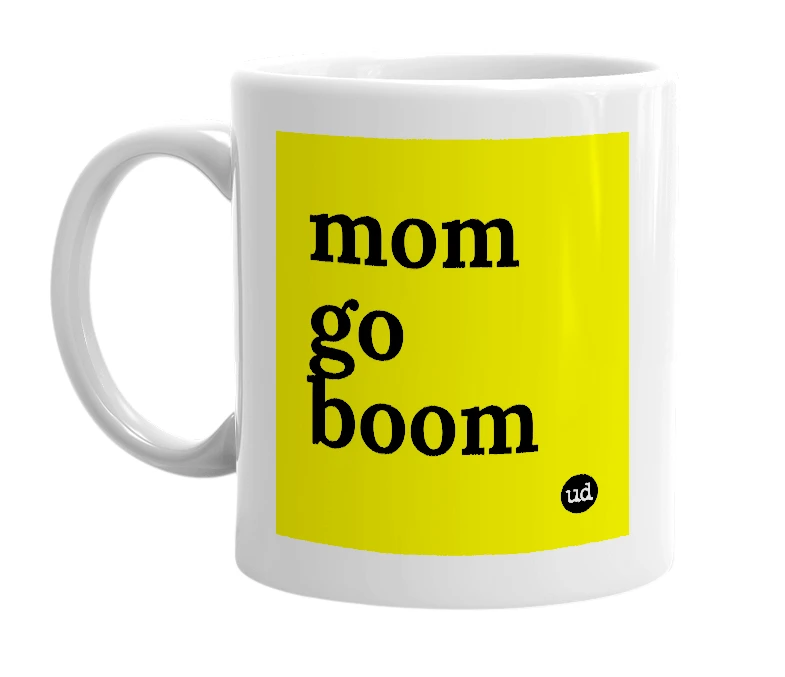 White mug with 'mom go boom' in bold black letters