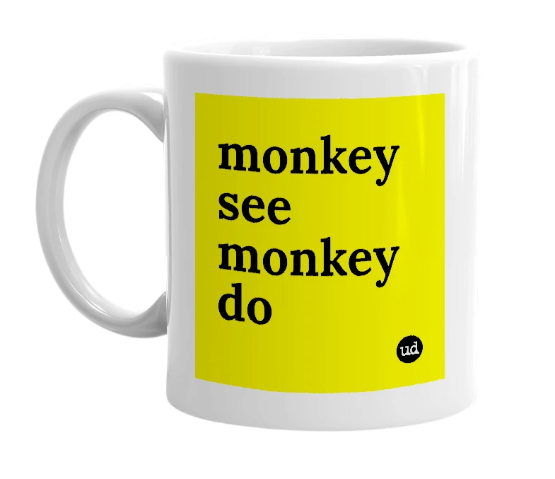White mug with 'monkey see monkey do' in bold black letters